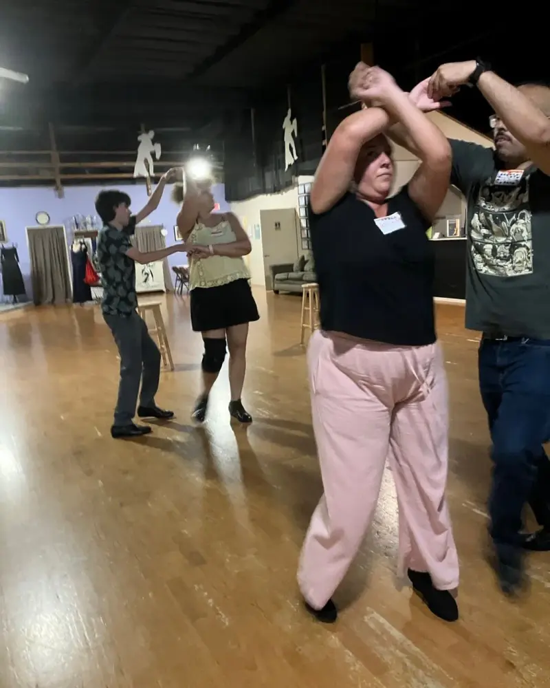 Students ballroom dancing in a House of Dance class